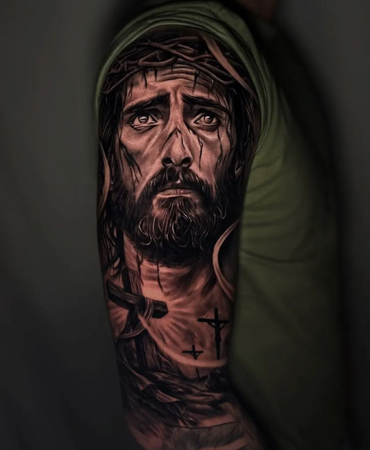 Big Black and Grey Jesus with Crown of Thorns and Cross Tattoo on Men Arm by @luansantostatto