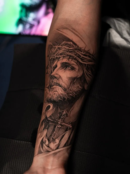 Big Black and Grey Jesus with Crown of Thorns and Cross Tattoo on Men Arm by @mauro________