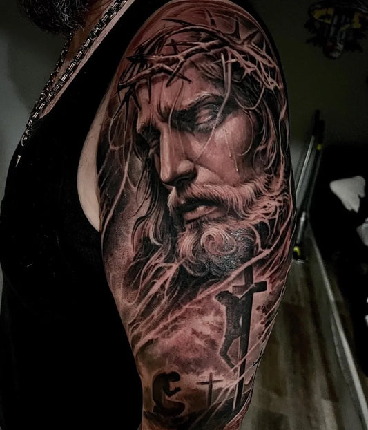 Big Black and Grey Jesus with Crown of Thorns and Cross Tattoo on Men Arm by @tjlinktattoos