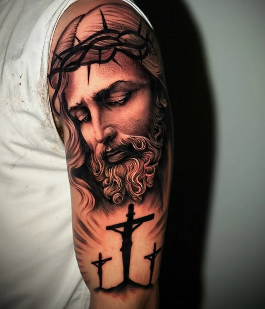 Big Black and Grey Jesus with Crown of Thorns and Crosses Tattoo on Men Arm by @rn_s_tattoo