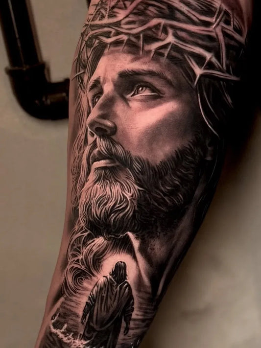 Big Black and Grey Jesus with Crown of Thorns and Walking Figure Tattoo on Men Arm by @hudsonsouzatattoo