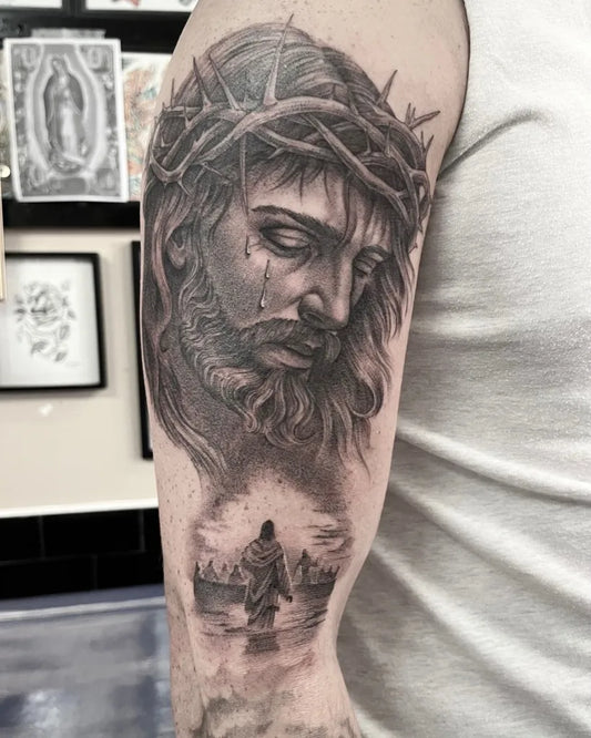 Big Black and Grey Jesus with Crown of Thorns and Walking on Water Tattoo on Men Arm by @lafamiliatattoo_nqy