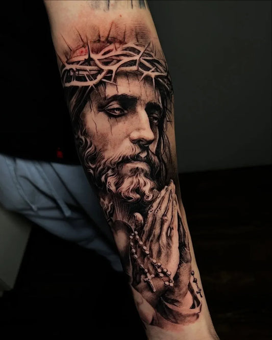Big Black and Grey Jesus with Rosary Tattoo on Men Arm by @reyr1tattoo