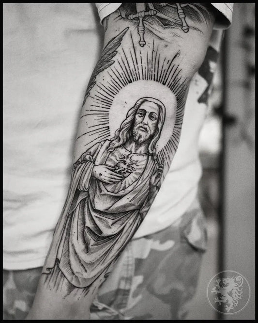 Big Black and Grey Jesus with Sacred Heart and Halo Tattoo on Men Arm by @jacob_tattoo