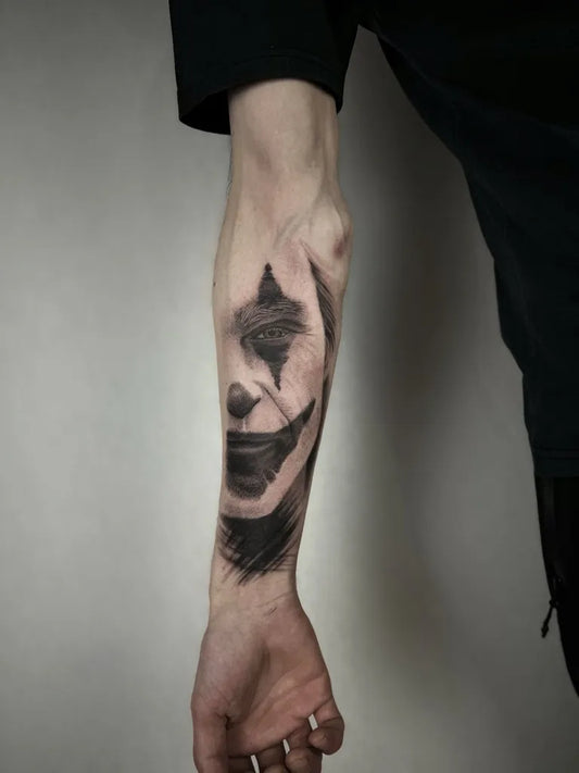 Big Black and Grey Joker Face on Men Arm Tattoo by @katia.iink