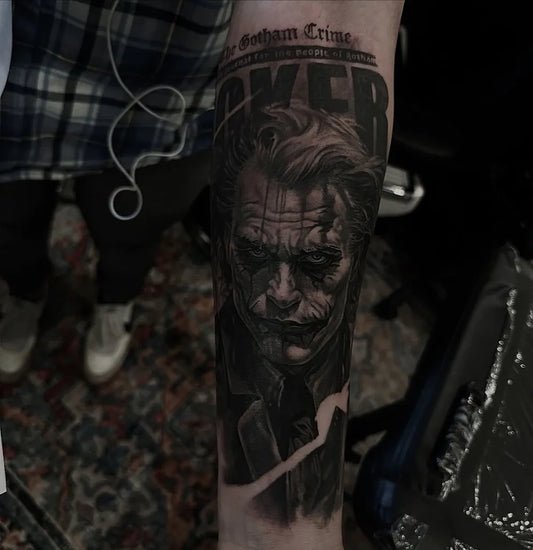 Big Black and Grey Joker Portrait on Men Arm Tattoo by @lukeloporto