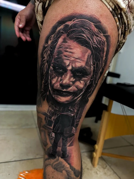 Big Black and Grey Joker Portrait on Men Thigh Tattoo by @tattoogit