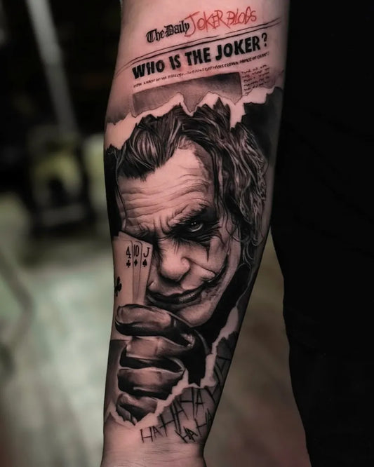 Big Black and Grey Joker Portrait with Cards on Men Arm Tattoo by @avi.liberman.tattoo