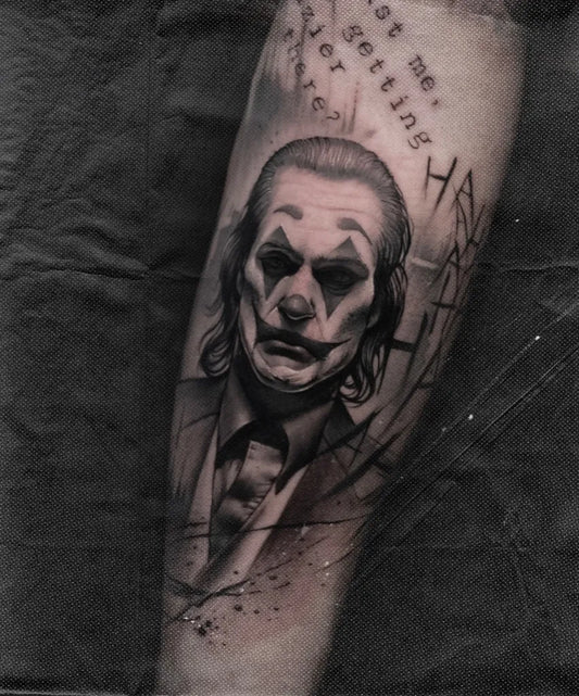Big Black and Grey Joker Portrait with Text on Men Arm Tattoo by @pawov