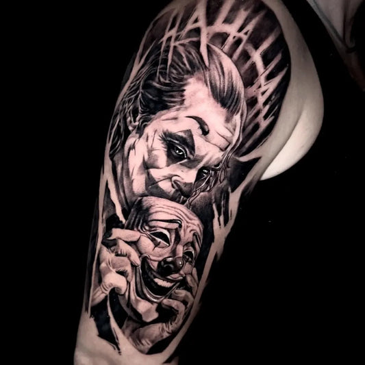 Big Black and Grey Joker and Mask on Men Arm Tattoo by @luigigala.tattoo