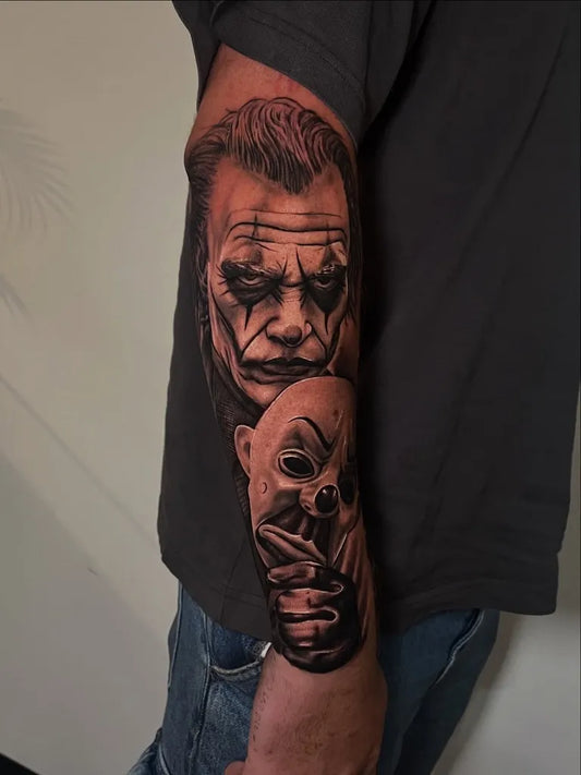Big Black and Grey Joker and Mask on Men Arm Tattoo by @miloman.ink