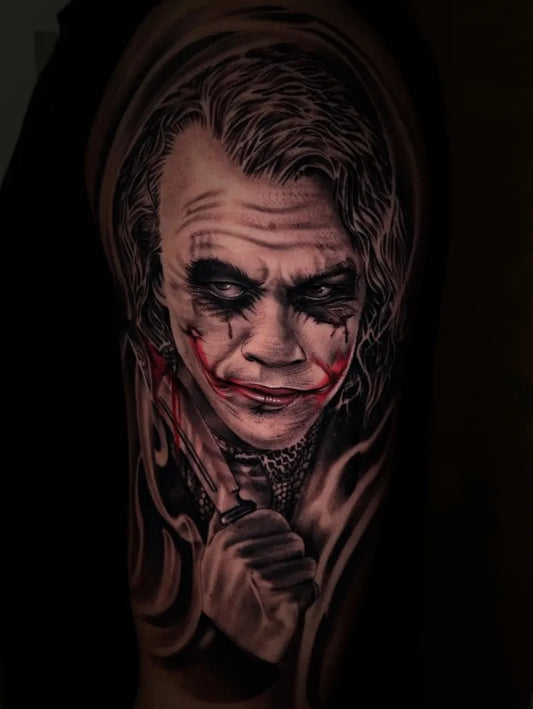 Big Black and Grey Joker on Men Arm Tattoo by @black.lucky.tattoo