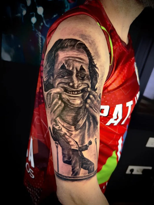 Big Black and Grey Joker on Men Arm Tattoo by @pipemartineztattoo