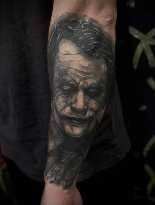 Big Black and Grey Joker portrait on Men Arm Tattoo by @johnnytrendkill