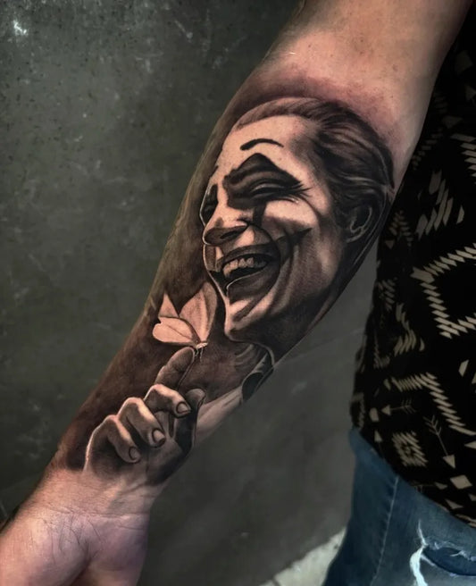 Big Black and Grey Joker with Butterfly and Hand on Men Arm Tattoo by @ramostattoo