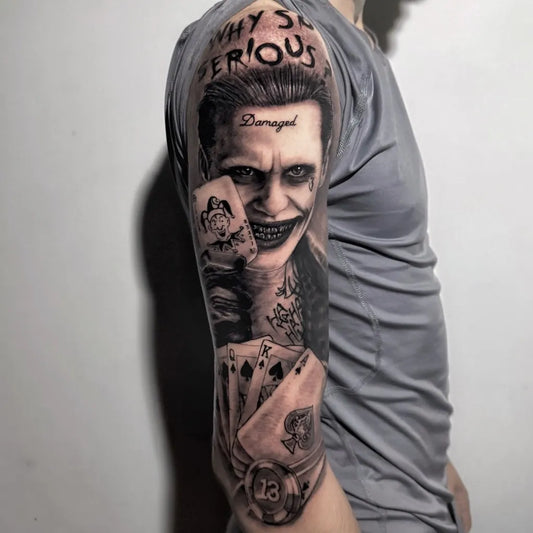 Big Black and Grey Joker with Cards on Men Arm Tattoo by @slash.tattoo