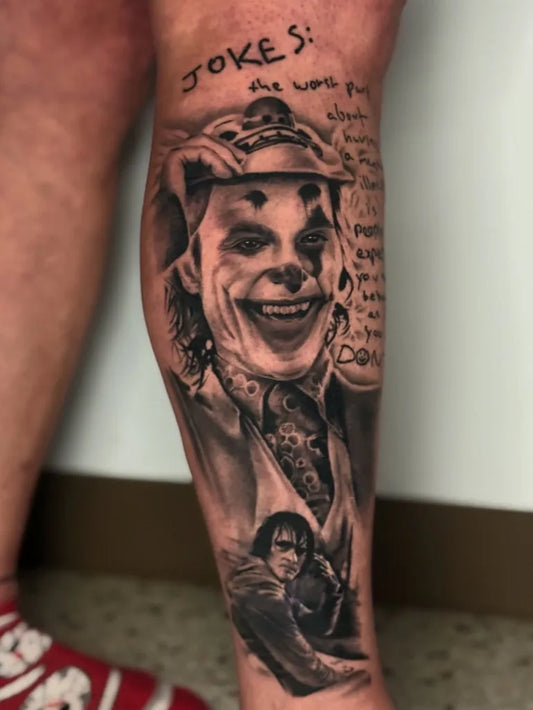 Big Black and Grey Joker with Portrait and Text on Men Leg Tattoo by @tattoosbyditty