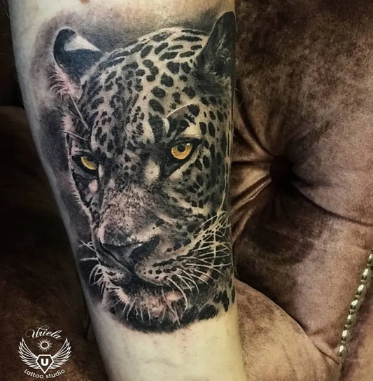 Big Black and Grey Leopard Head Animal Tattoo on Men Arm by @uriela_tattoo