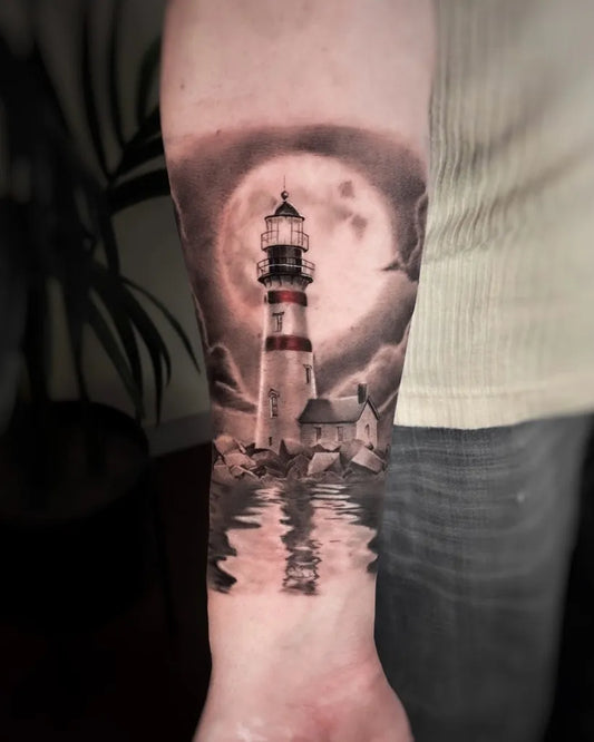 Big Black and Grey Lighthouse Moon Reflection Tattoo on Men Arm by @yoav_tattooer