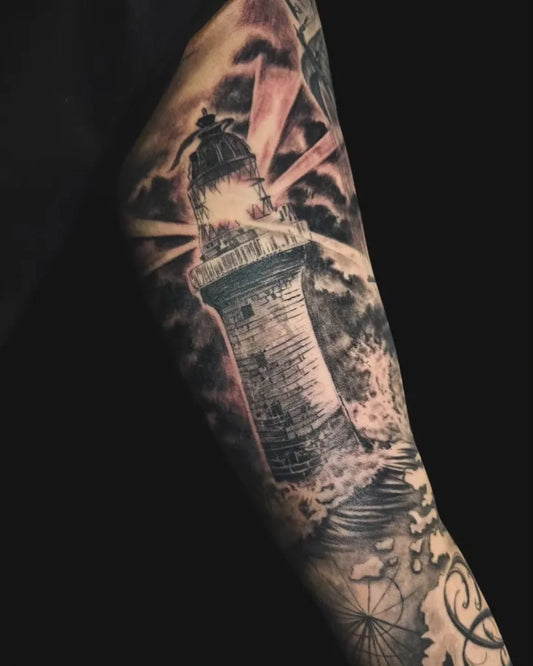 Big Black and Grey Lighthouse with Beams and Waves Tattoo on Men Inner Arm by @ahbeesiang_bugistattoo