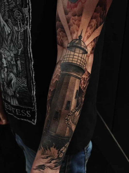 Big Black and Grey Lighthouse with Clouds and Flowers Tattoo on Men Arm by @disramos.ink