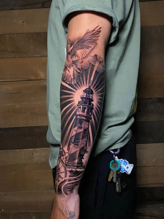 Big Black and Grey Lighthouse with Eagle Tattoo on Men Arm by @ozzytat2
