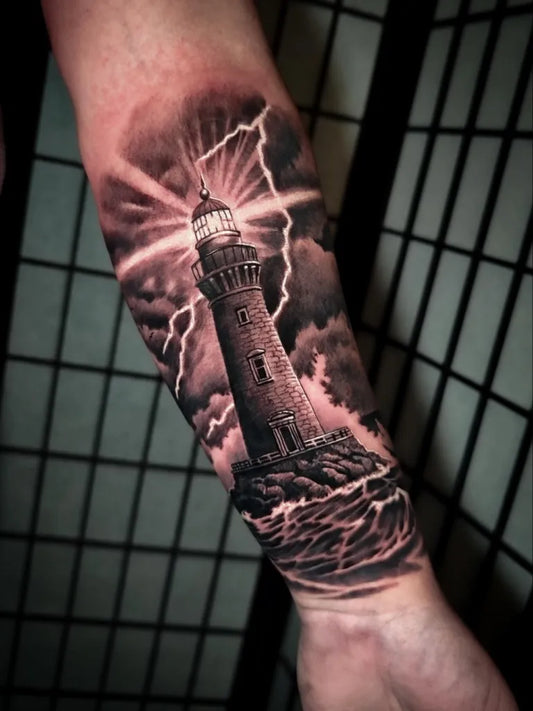 Big Black and Grey Lighthouse with Storm and Waves Tattoo on Men Arm by @1ur2tattoo