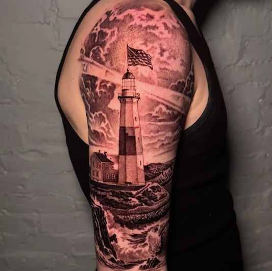Big Black and Grey Lighthouse with Stormy Sea Tattoo on Men Arm by @markvatatattoo