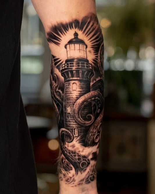 Big Black and Grey Lighthouse with Tentacles Tattoo on Men Arm by @hopelesstattoo
