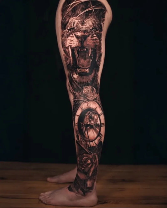 Big Black and Grey Lion Clock Rose Tattoo on Men Leg by @peter.morgan
