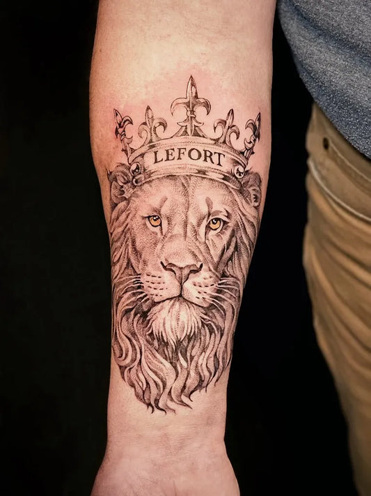 Big Black and Grey Lion Crown with Name on Men Arm Tattoo by @leetattooing