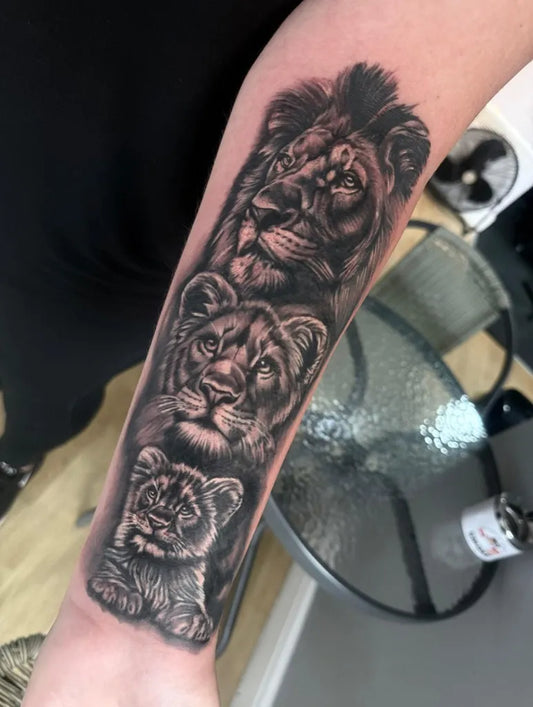 Big Black and Grey Lion Family on Women Arm Tattoo by @inksanity_canvey