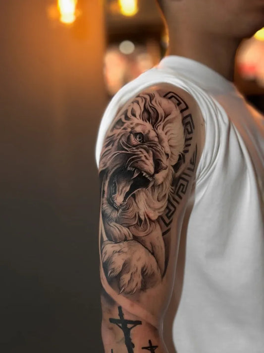 Big Black and Grey Lion Greek Crosses on Men Arm Tattoo by @guiotaviotattoo