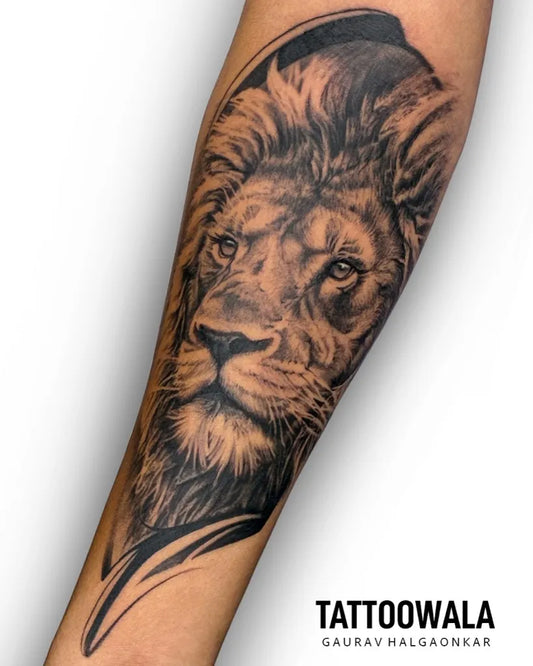 Big Black and Grey Lion Head Tattoo on Men Arm by @tattoowalaindia