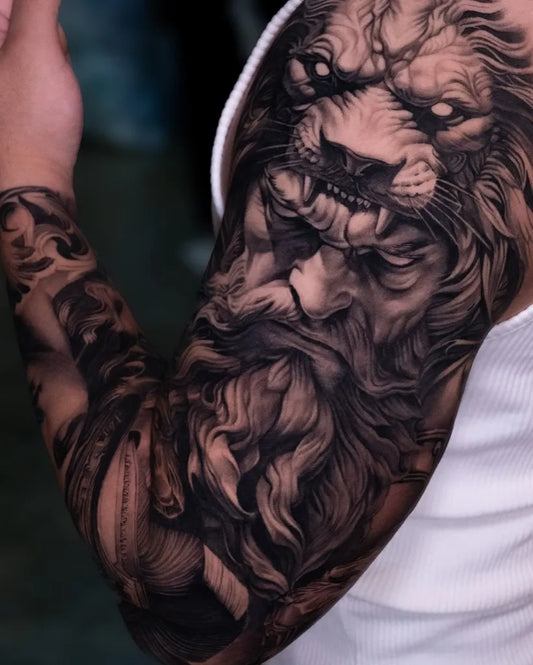Big Black and Grey Lion Tattoo on Men Upper Arm by @bega.tattooist