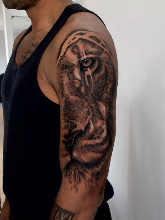 Big Black and Grey Lion Tattoo on Men Upper Arm by @hillsidetattoostudio