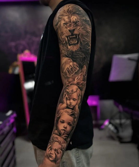 Big Black and Grey Lion and Cherubs on Men Arm Tattoo by @pure_ink_sinsheim