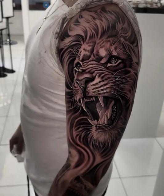 Big Black and Grey Lion on Men Arm Tattoo by @russotattoosnyc