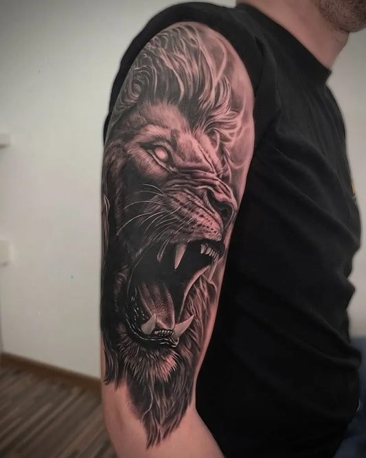Big Black and Grey Lion on Men Arm Tattoo by @travel_and_tattoo