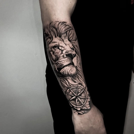 Big Black and Grey Lion with Compass on Men Arm Tattoo by @lucasbischoff.tattoo