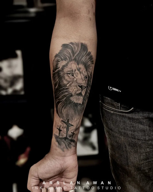 Big Black and Grey Lion with Crosses on Men Arm Tattoo by @inkisland.studio