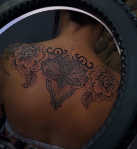 Big Black and Grey Lotus Flower Mandala on Women Back Tattoo by @rora.ink