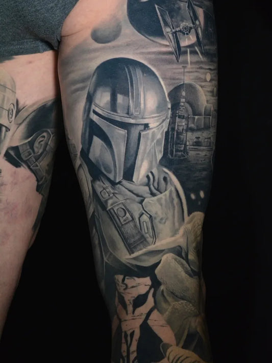 Big Black and Grey Mandalorian and Grogu Star Wars Tattoo on Men Thigh by @alexandra.domok.tattoo