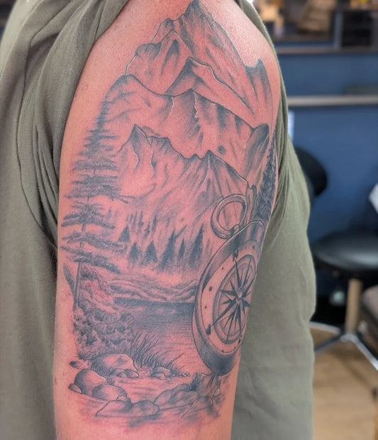 Big Black and Grey Mountain Compass Tattoo on Men Shoulder by @darrenfoxtattoo