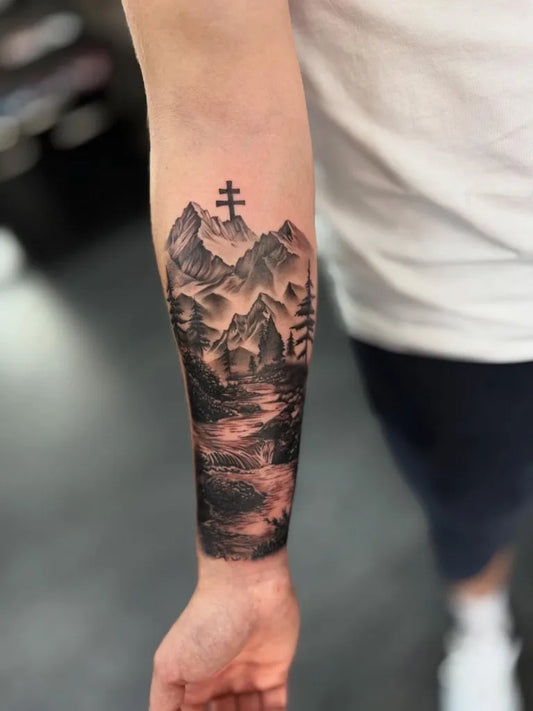 Big Black and Grey Mountain Cross Landscape Tattoo on Men Arm by @blostma.tattoos