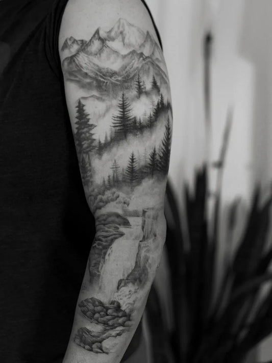 Big Black and Grey Mountain Forest Waterfall Tattoo on Men Arm by @quindaytattoos