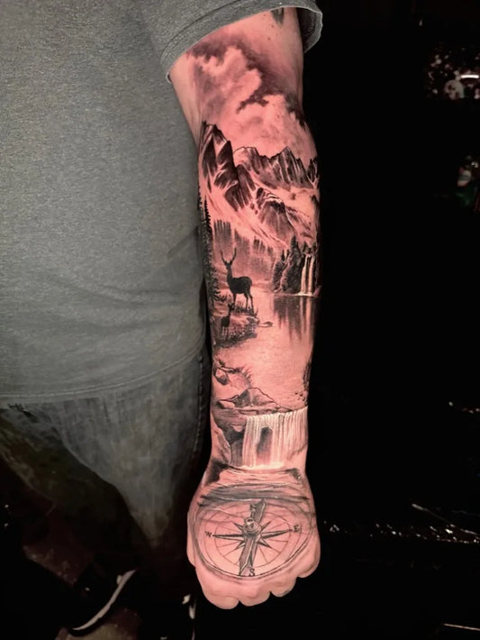 Big Black and Grey Mountain Landscape with Deer and Waterfall Tattoo on Men Arm by @forsakenink