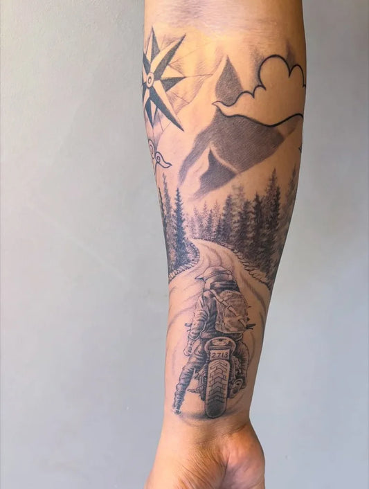 Big Black and Grey Mountain Motorcycle Tattoo on Men Arm by @kshitij_gurav