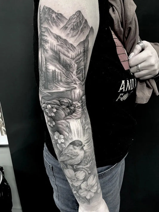 Big Black and Grey Mountain Waterfall Bird Nature Tattoo on Women Arm by @claire_skowtattoos