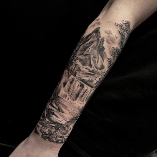 Big Black and Grey Mountain Waterfall Forest Tattoo on Men Arm by @_paulayvonne_